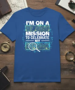 T-shirt featuring the text "I'M ON A TOP SECRET MISSION TO CELEBRATE MY BIRTHDAY" in blue and white with digital