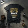 Black t-shirt with "Torn Between Looking Like A Snack Or Eating One" gym humor quote and barbell graphic