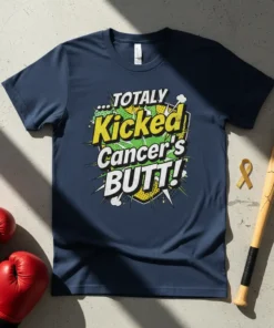 Navy t-shirt with bold yellow and green text that reads "TOTALLY Kicked Cancer's BUTT!" in a comic book style, featuring