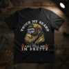 Black t-shirt with "Touch My Beard And Tell Me Im Pretty" text and a gorilla wearing a cap and flames