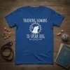 Training Humans To Speak Dog funny t-shirt with illustration of a dog barking within a paw print circle