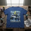 Tralalero Tralala text above a shark wearing sneakers with a city skyline graphic on a blue t-shirt