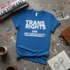 Blue t-shirt with white text reading "TRANS RIGHTS ARE HUMAN RIGHTS"