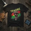 Traoré fist and Burkina Faso flag design on a black t-shirt, symbolizing heritage and resistance