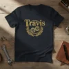 Black t-shirt with gold glitter "Travis" text and gear emblem. Personalized name design