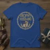 Trophy Husband t-shirt design featuring bold text within a decorative circular emblem with a shield and laurel leaves