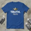 Blue t-shirt with white text "TRUTH. TRUTH." and a golden crown graphic above it
