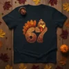 A black t-shirt featuring the number 67 designed with a festive turkey head and tail feathers, celebrating Thanksgiving
