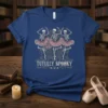 Tutully Spooky t-shirt design with three skeletons in pink tutus dancing, holding a bag, and the text "Tutully Spooky" below