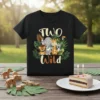 Two Wild birthday t-shirt featuring a cute elephant, giraffe, lion, zebra, and turtle surrounded by jungle leaves