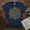 Navy t-shirt with gold glitter text "UNCLE MATT" inside an ornate frame, perfect uncle gift