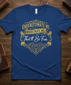 Underestimate Me. Underestimate Me: That'll Be Fun. quote on a navy blue t-shirt with gold ornate graphic elements