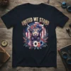 United We Stand Highland Cow T-Shirt with American flag and floral wreath. Patriotic graphic tee