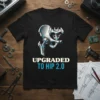 Black t-shirt with "UPGRADED TO HIP 2.0" text and a stylized metallic hip joint graphic