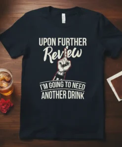 Black t-shirt with white text: "UPON FURTHER Review I'M GOING TO NEED ANOTHER DRINK" and a graphic of a finger