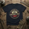 Vintage 1962 T-Shirt with retro circular design and gear graphic, available in navy blue