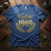 Vintage 1969 text with golden laurel wreath design on a blue t-shirt, celebrating a birth year