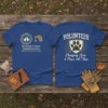 Volunteer t-shirt with "Changing Lives 4 Paws At Time" text and a paw print emblem