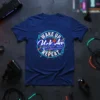 Wake Up Kick Ass Repeat motivational quote t-shirt with neon-style circular design and lightning accents