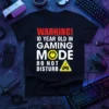 Warning! 10 Year Old In Gaming Mode Do Not Disturb text with gaming icons on a black t-shirt
