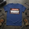 Warning Dialysis Patient With An Attitude text design on a blue t-shirt with industrial graphics