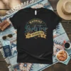 WARNING Girls Trip IN PROGRESS text graphic on a black t-shirt, featuring retro-style typography and travel icons like airplanes and