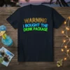 Navy t-shirt with "WARNING I BOUGHT THE DRINK PACKAGE" text in gold, blue, and green lettering