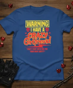 Warning I Have A Crazy Girlfriend text with skulls and lightning bolt graphic on a blue t-shirt