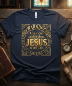 Navy blue t-shirt with gold ornate design featuring text "WARNING! I may start talking about JESUS at any time"