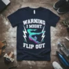 Gymnast performing a flip on a dark t-shirt with "Warning I Might Flip Out" text and lightning graphics