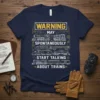 Navy blue t-shirt with white text "WARNING MAY SPONTANEOUSLY START TALKING ABOUT TRAINS" and illustrations of various trains