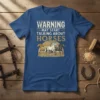 T-shirt with "Warning May Start Talking About Horses" text and graphic of three running horses at sunset