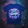 WARNING OFFICIAL TEENAGER Teenager MAY CONTAIN ATTITUDE text design with neon lightning and circular accents on a blue t-shirt