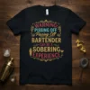 Black t-shirt with "WARNING: PISSING OFF Pissing Off the BARTENDER CAN BE A SOERING EXPERIENCE" quote in vintage distressed style