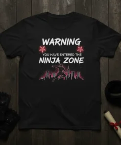 T-shirt with "Warning You Have Entered The Ninja Zone" text, featuring a silhouette of a ninja jumping over a cityscape