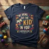 Navy blue t-shirt featuring colorful circus-themed design with text "WE BRING OUT THE KID IN YOU" and "#LABOR&DELIVERY" with elephant