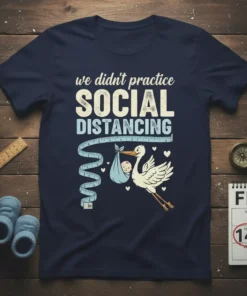 T-shirt with text "we didn't practice SOCIAL DISTANCING" featuring a stork carrying a baby and a measuring tape
