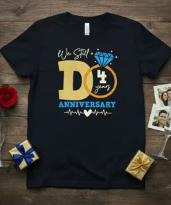 Black t-shirt with "We Still Do 4 years ANNIVERSARY" text, a large gold 'D', a diamond ring with '4 years'