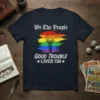 We The People GOOD TROUBLE LIVES ON t-shirt with rainbow torch graphic, symbolizing equality and activism