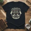 Wears Black Loves Dogs Avoids People Introvert's Creed text design on a black t-shirt with dog graphics and paw prints