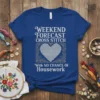 Royal blue t-shirt with "WEEKEND FORECAST CROSS STITCH With NO CHANCE Of Housework" text and a cross-stitched heart graphic