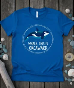 Orca whale with text "WHALE, THIS IS ORCAWARD" inside a circular frame on a royal blue t-shirt