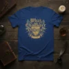 What Character Defects? text in gothic font on a vintage shield graphic, with wings and dragons, on a blue t-shirt