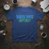 Blue t-shirt with "WHAT JUST HAPPENED?" in vibrant green and blue fractured text, suitable for confused or surprised individuals