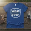Blue t-shirt with distressed white text "what. ever." inside a shield shape, expressing a sarcastic attitude