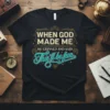 Black t-shirt with the quote "When God Made Me He Grinned And Said This'll Be Fun" in vintage-inspired typography