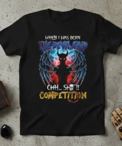 Black t-shirt with "When I Was Born The Devil Said Ohh Sh*t Competition" text and a demonic graphic with wings