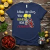 Navy blue t-shirt with white and yellow text reading "When life Gives YOU LEMONS BOIL" and red text "CRAWFISH," featuring