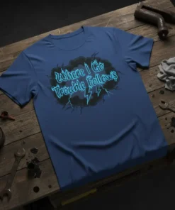 T-shirt with the quote "Where I Go Trouble Follows" in neon blue stylized text with lightning bolts and a dark
