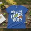 Who Let The Frogs Out? text design with three colorful frogs on a blue t-shirt
